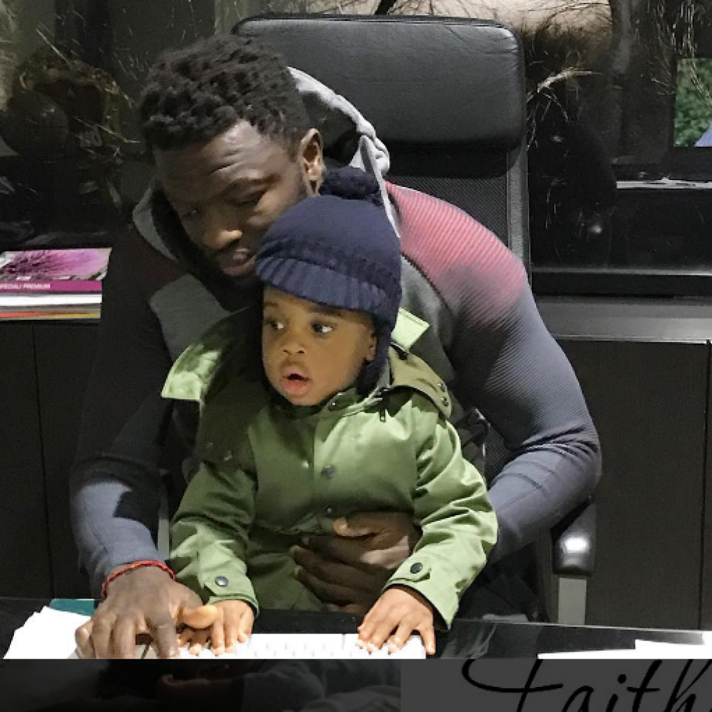 PHOTO: Sulley Muntari spends time with son in his office