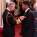 Joshua receives OBE award from Prince Charles