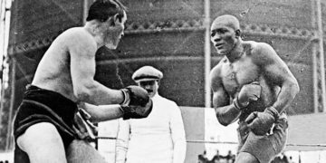 Today in Sports History: African-American boxer Jack Johnson stops Canadian defending champion Tommy Burns to become first black man to win world heavyweight title