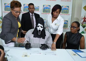 Lottery winner wears Scream mask to collect £1million Jamaican Lottery prize ‘so his relatives won’t hound him for money’