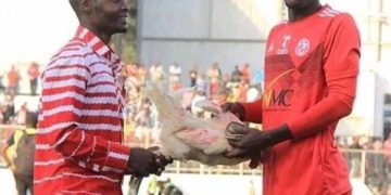 Photo: Player receives live chicken for being Man-of-the-match in Malawi