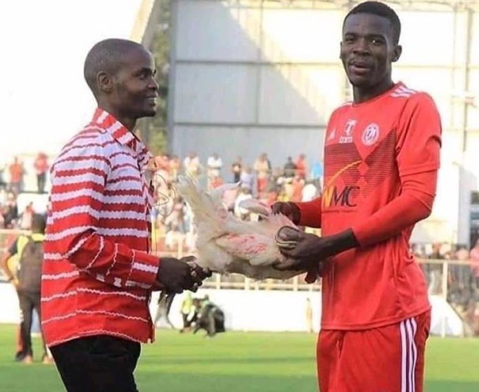 Photo: Player receives live chicken for being Man-of-the-match in Malawi