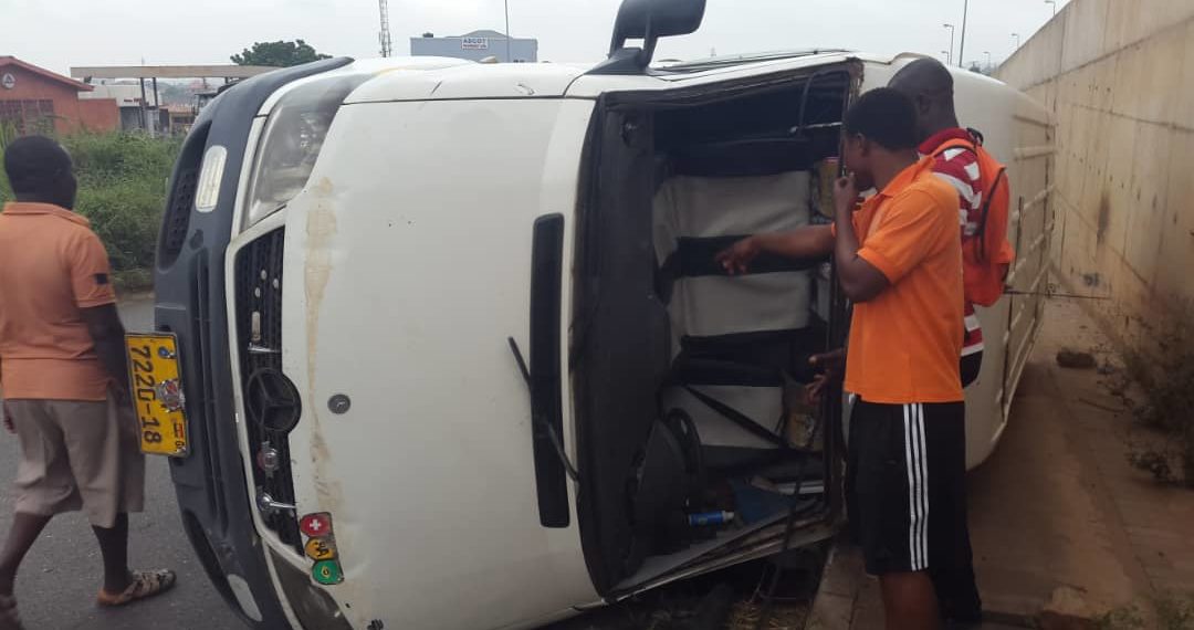 Photos: Driver escapes death, as bus somersaults on Awoshie-Ablekuma road