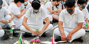 Hundreds join sit-in at school of shot Hong Kong protester