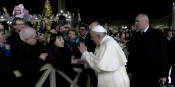Pope Francis apologises after slapping a female worshipper who grabbed his hand