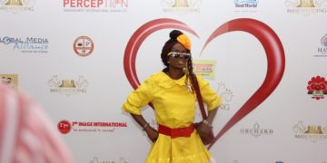 Photos:Woman in Happy FM colours storms Mass wedding to support program