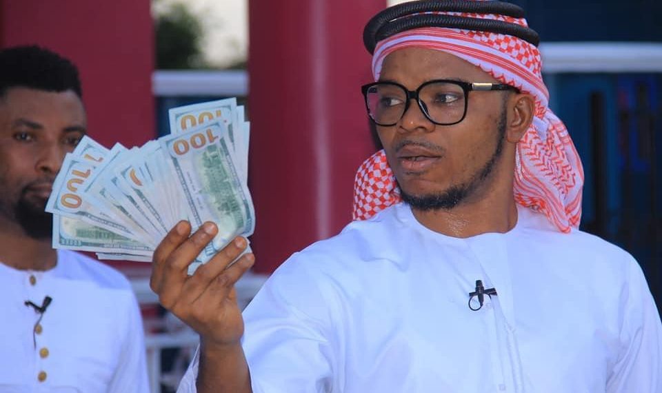 Obinim flaunts dollar notes as he celebrates release from police custody