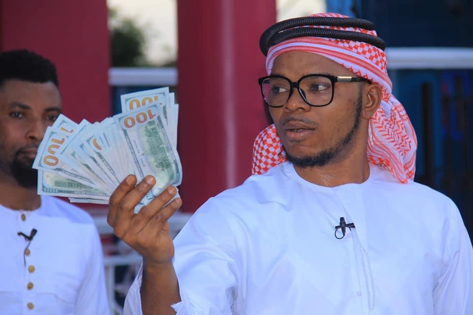 Obinim flaunts dollar notes as he celebrates release from police custody