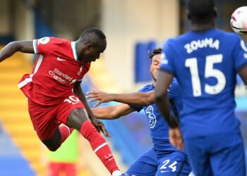 Mane nets double as Liverpool beat 10-man Chelsea