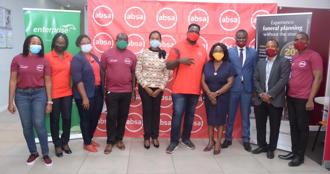 Officials of Absa Bank and Transitions in a group picture