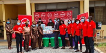 Absa Bank employees presenting the items to officials of the Senior Correctional Centre