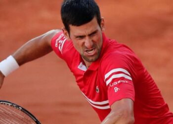 Djokovic fights back to win French Open