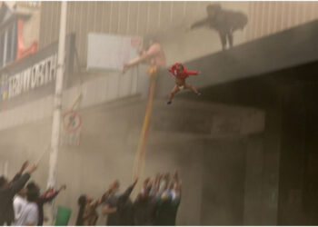 Zuma riots: Child thrown from burning building in South Africa