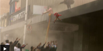 Zuma riots: Child thrown from burning building in South Africa