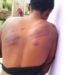 Photos: Headmaster lashes a lady to pulp for helping a colleague