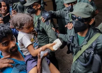 Sri Lanka swears in acting leader after mass protests