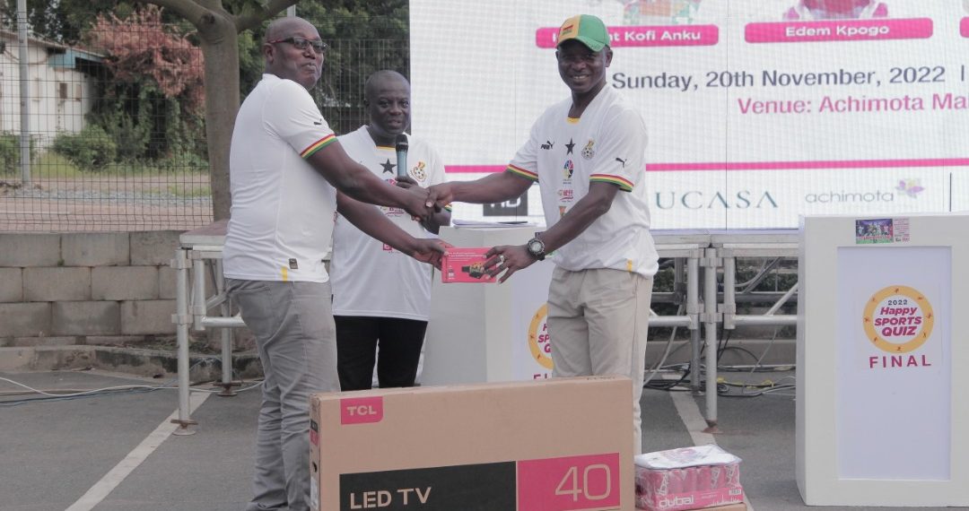 Sports Journalist, Ekow Asmah presenting prizes to Happy Sports Quiz winner, Edem Kpozo