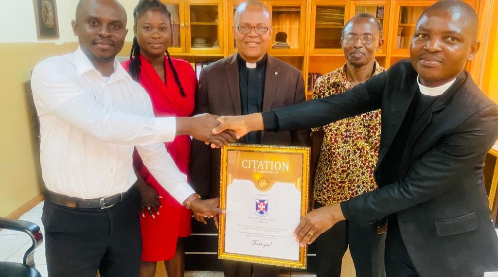 Happy FM presents citation of honor to Osu Eben-ezer Presbyterian Church