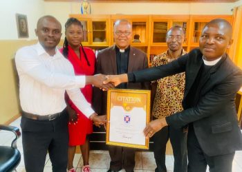 Happy FM presents citation of honor to Osu Eben-ezer Presbyterian Church