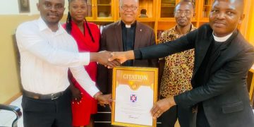 Happy FM presents citation of honor to Osu Eben-ezer Presbyterian Church