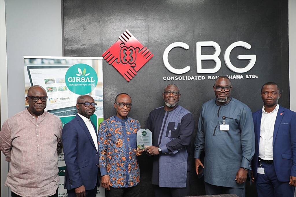 CEO of GIRSAL, Mr. Kwesi Korboe (L), and MD of CBG, Mr. Daniel Wilson Addo receiving the award from COO of GIRSAL
