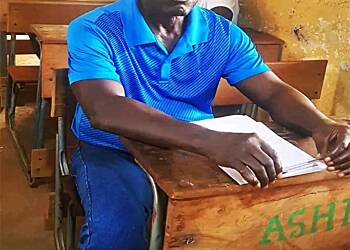 71 year old man sits for 2024 BECE examination
