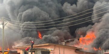 Adabraka Residents Urge Fire Service to Extinguish Lingering Warehouse Fire Amid Health Concerns