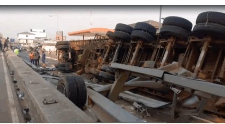 Truck overturns near Circle overhead, causes heavy traffic; no injuries reported